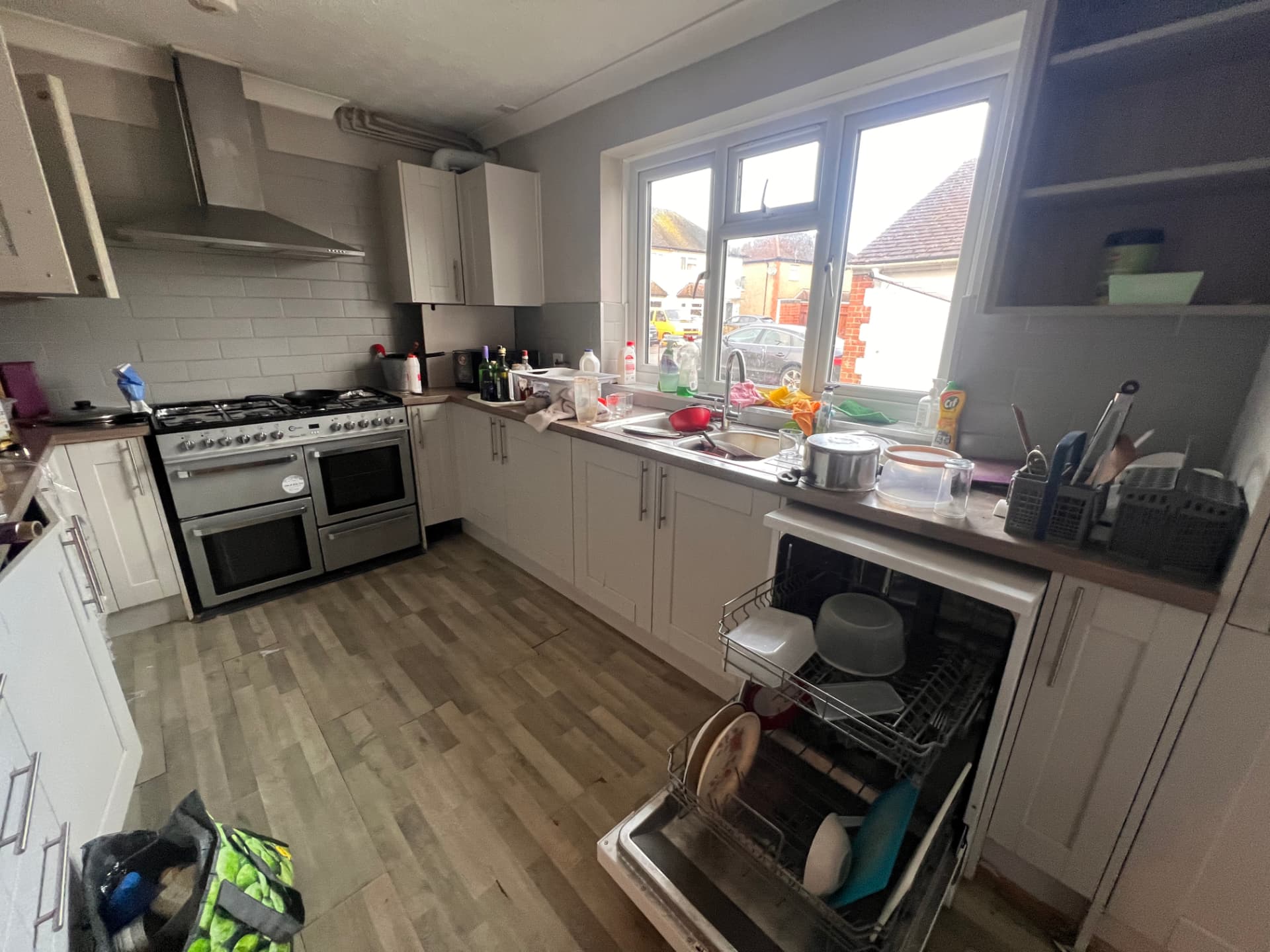 Dated cluttered kitchen before renovation by RedFox Homes in Oxfordshire