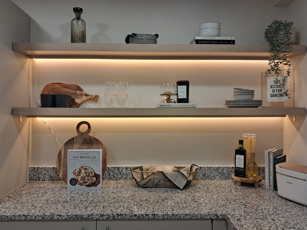 Oak kitchen shelving with concealed lighting above a granite worktop in an Oxfordshire kitchen renovation