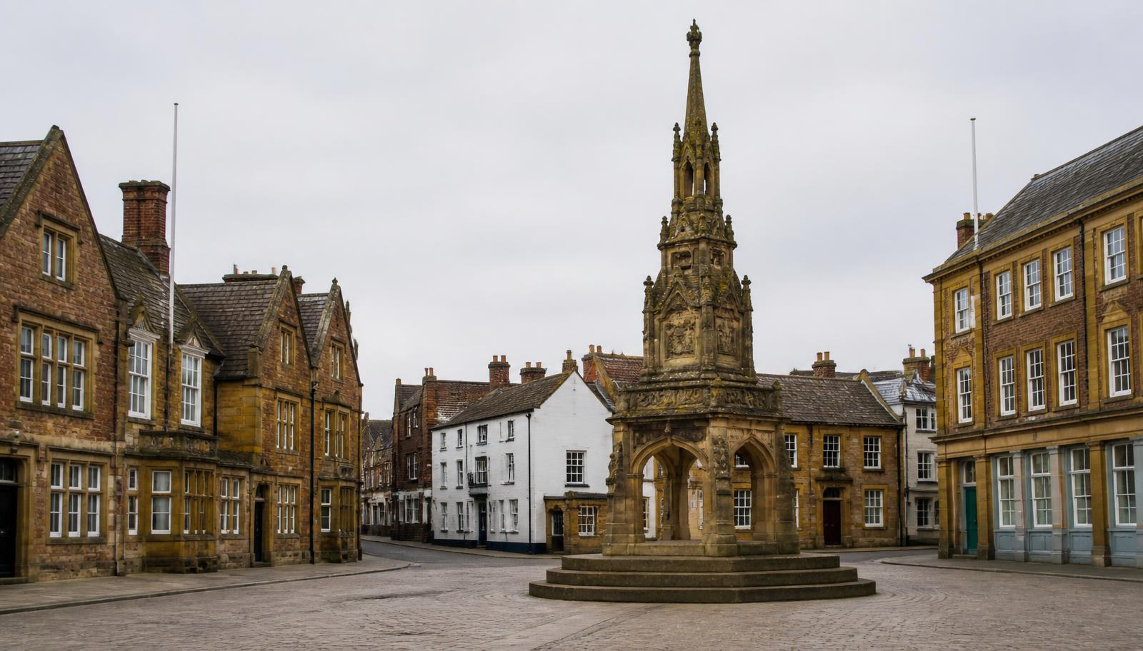 Banbury Cross and ironstone town-centre buildings in Banbury, Oxfordshire